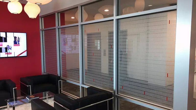 Frosted glass media or etch vinyl refers to a window application in which a translucent adhesive film is applied to the surface of the glass.